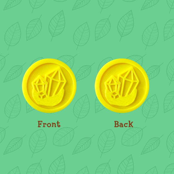 3D printed gold icon coins with crystal-inspired design, front and back