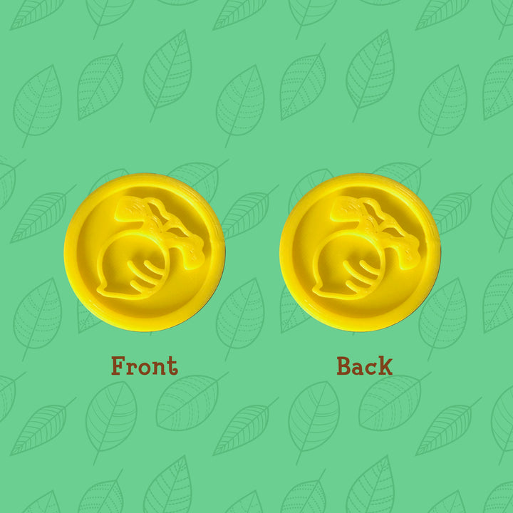 3D printed yellow coins with turnip design on both sides