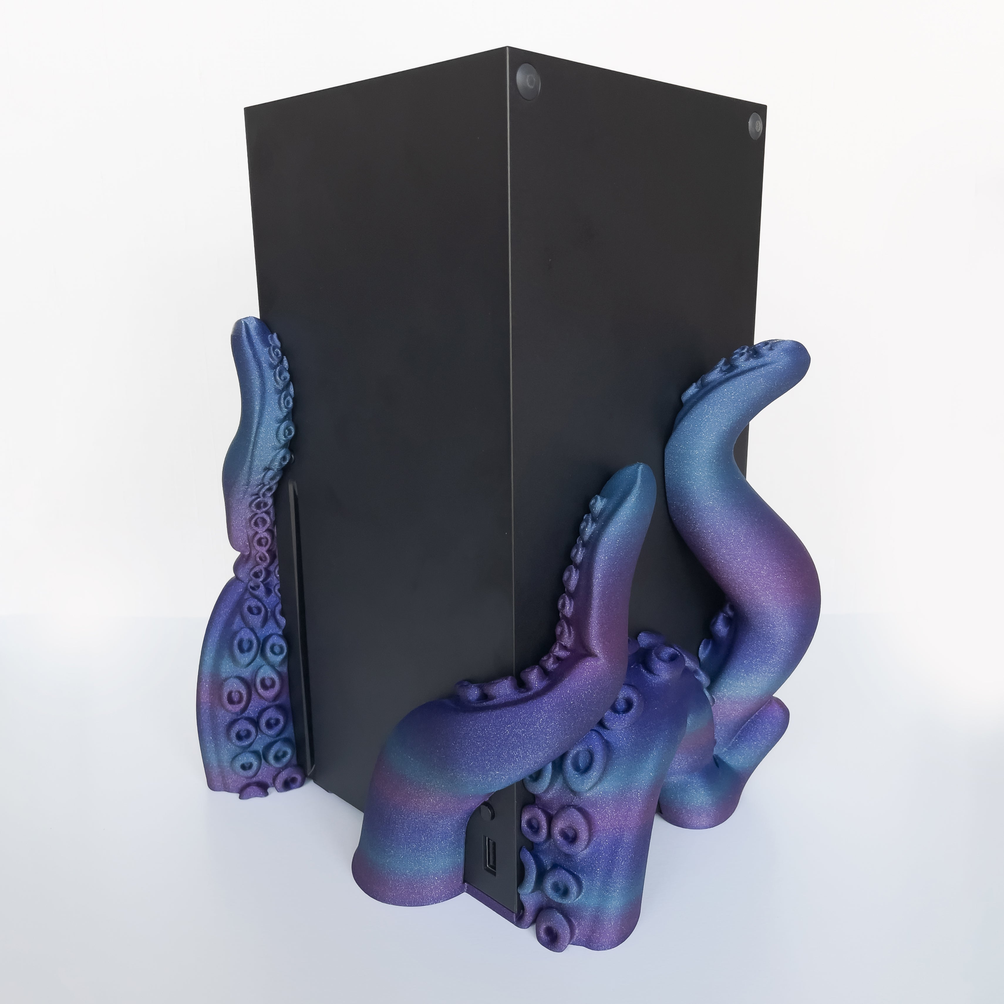 3D printed tentacle-style dock for vertical gaming console on white background.
