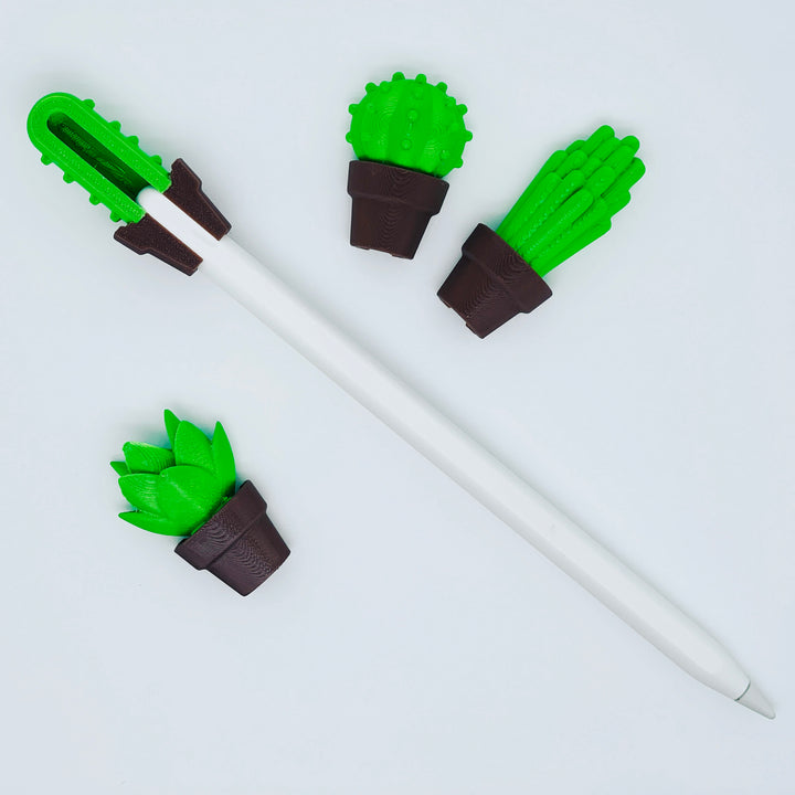 Set of four small 3D printed succulent clips for stylus or pen on white background