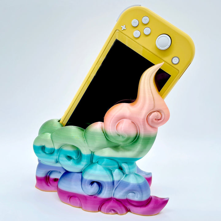 Rainbow gradient 3D printed cloud-style dock for compact handheld console on white background