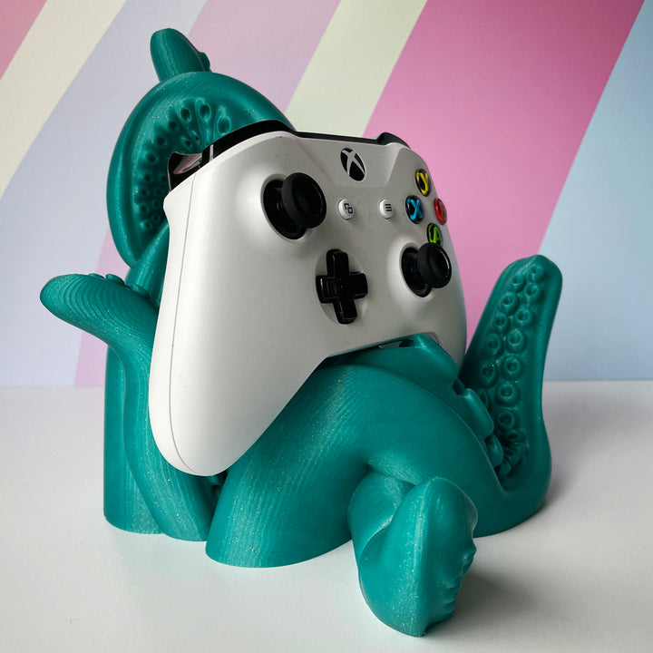 White Gaming Controller on Mermaids Tale Green 3D printed tentacle-style controller stand on colorful background