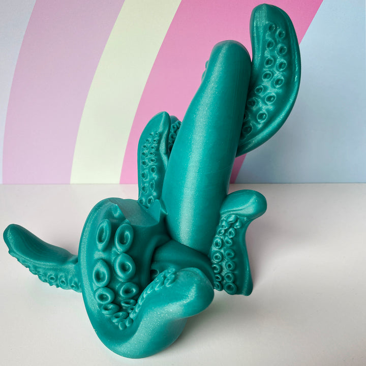 Mermaids Tale Green 3D printed tentacle-style controller stand on colorful background