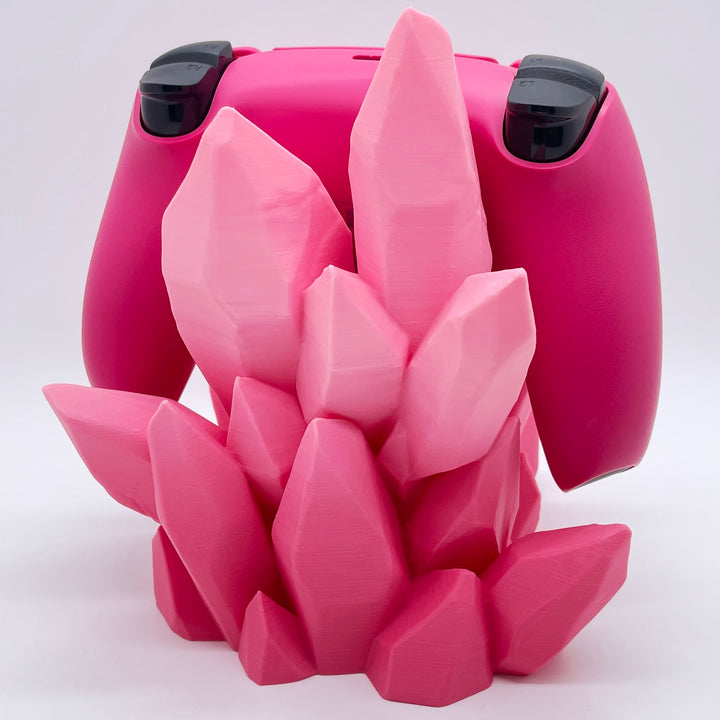 Pink ombre 3D printed crystal-style controller stand with a pink and black controller on a white background