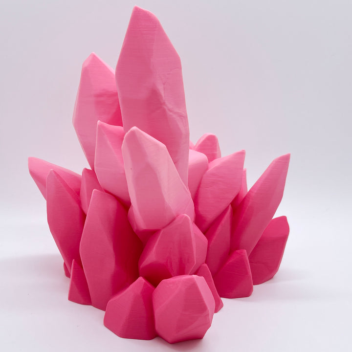 Pink ombre 3D printed crystal-style controller stand on a white background